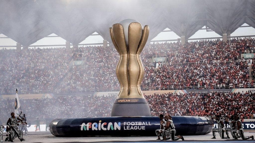 African football trophy in a packed stadium for an AFCON 2027 travel experience